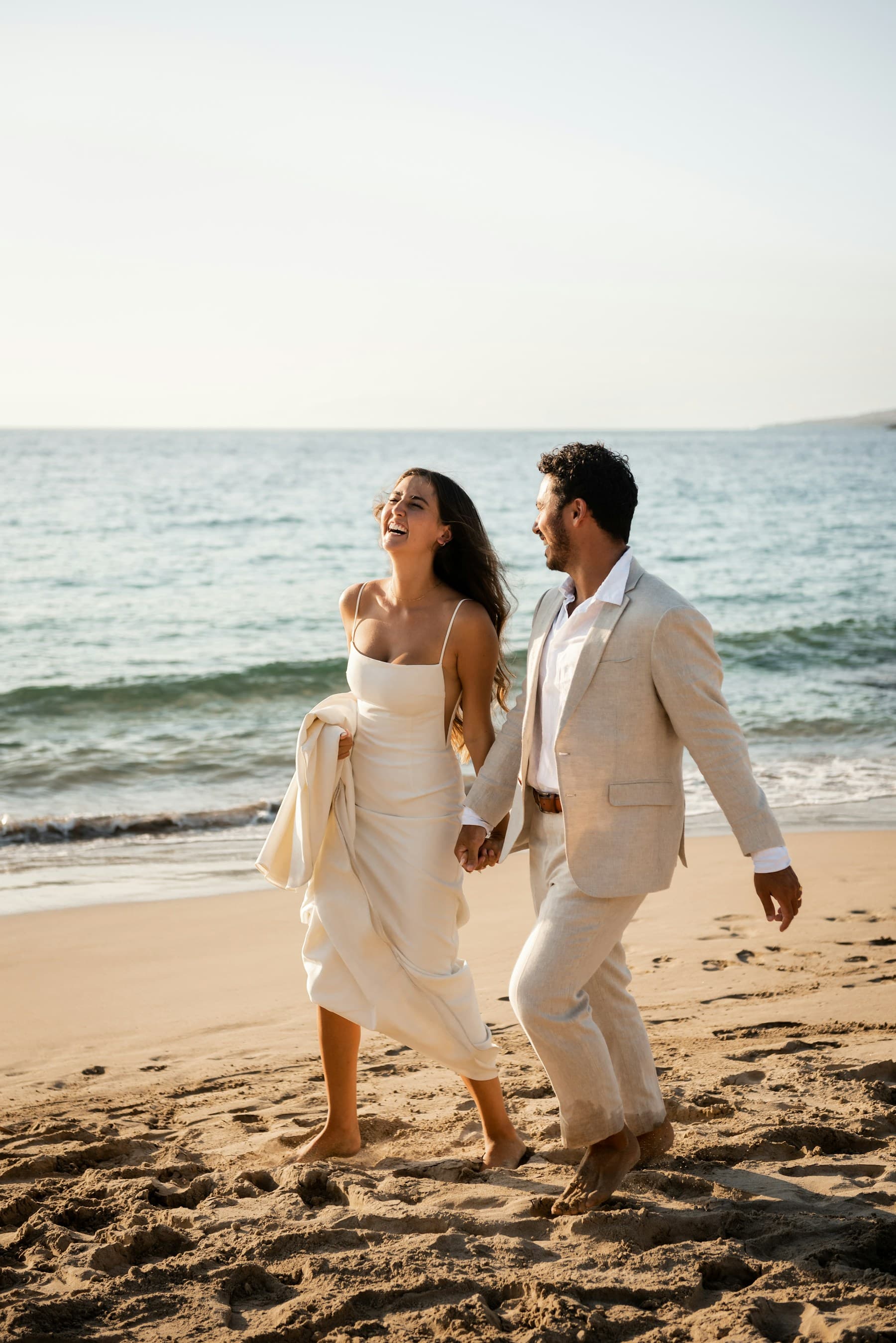 Newlywed beach portraits at sunset