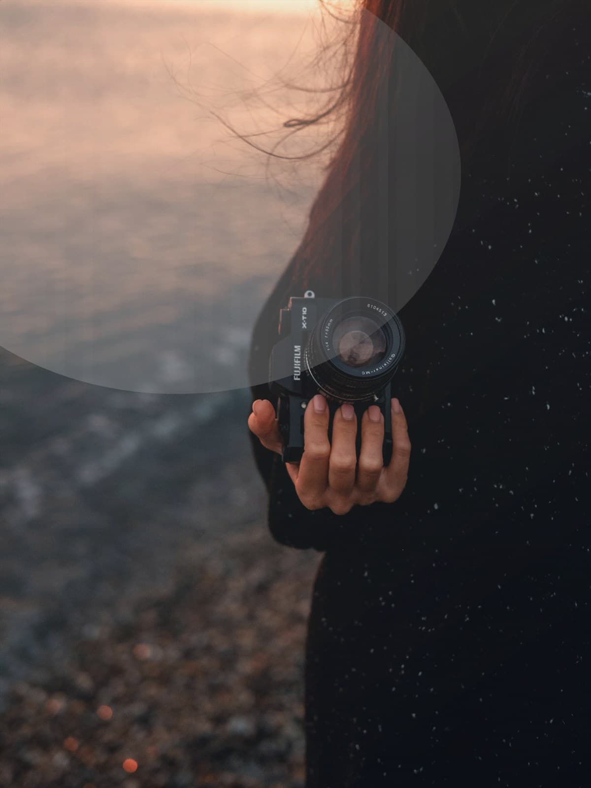 Couple hugging on the beach at sunset.