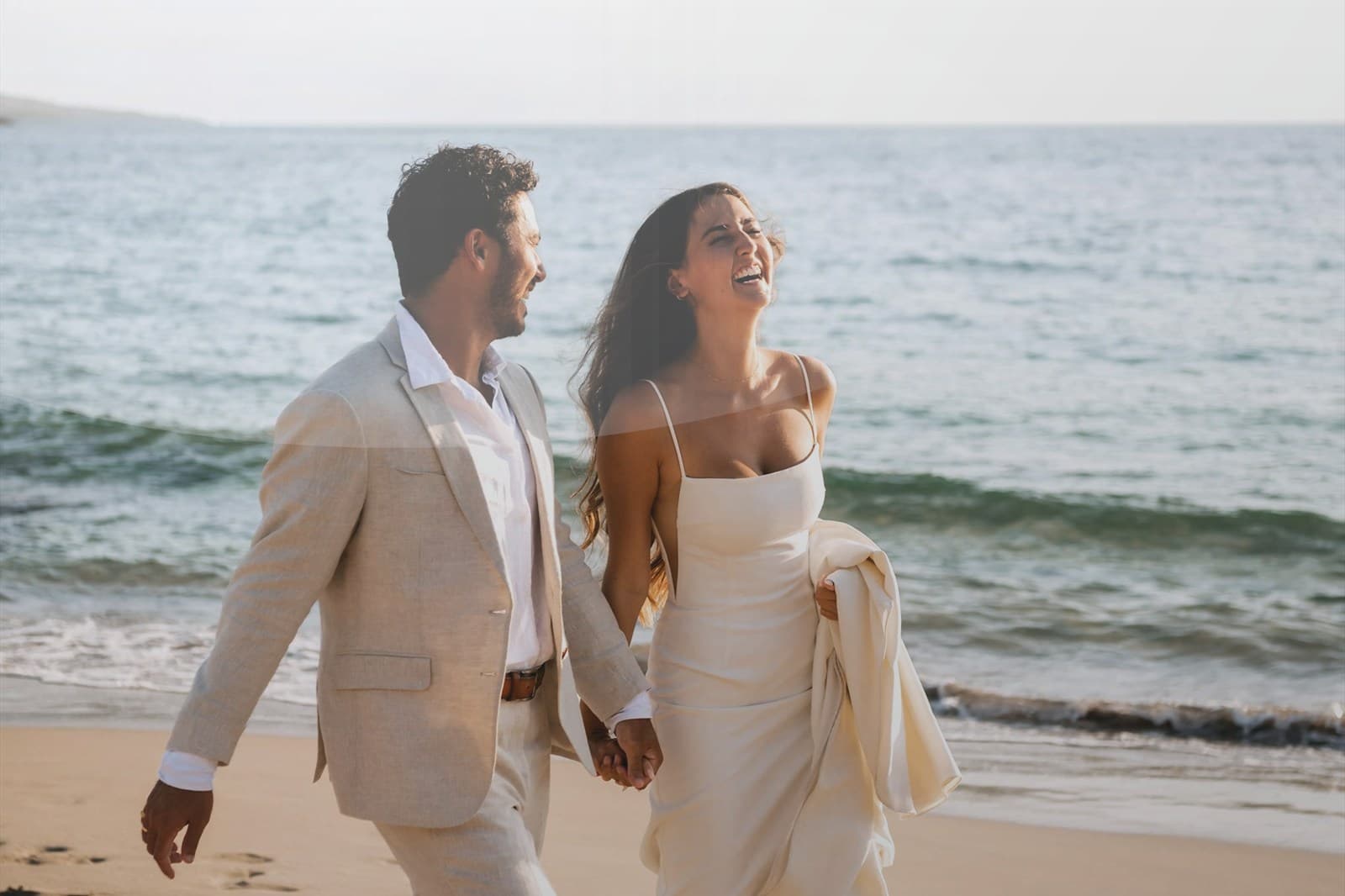 Resort pool overlooking a tropical beach and ocean.