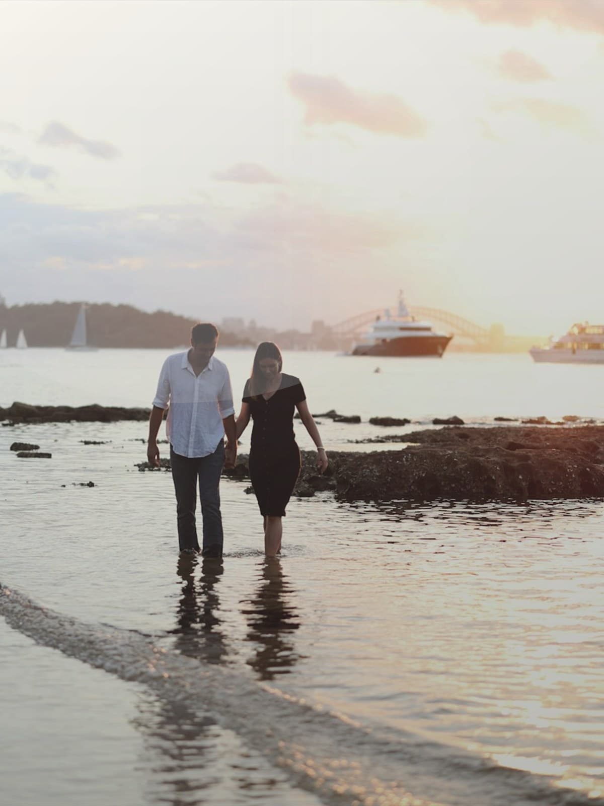 Newlywed couple embracing on a beach after the ceremony.